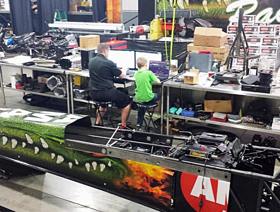 Rob Wendland and son Carter share a moment together in the Brownsburg, Ind., shop, trying to sort out some clutch packages. (Photo courtesy of Rob Wendland)