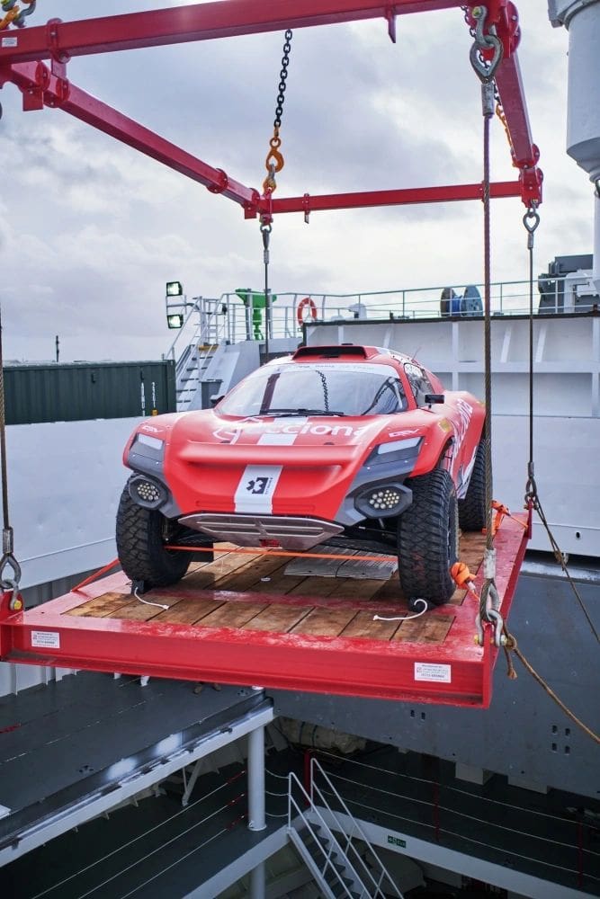 The ACCIONA/Sainz Olyssey 21 of Spanish teammates Carlos Sainz and Laia Sanz is loaded onto The St. Helena for its histroic voyage to Saudi Arabaia for the Extreme E inaugural event at Al-'Ula. (Photo by Ollie Emery, courtesy of Extreme E)