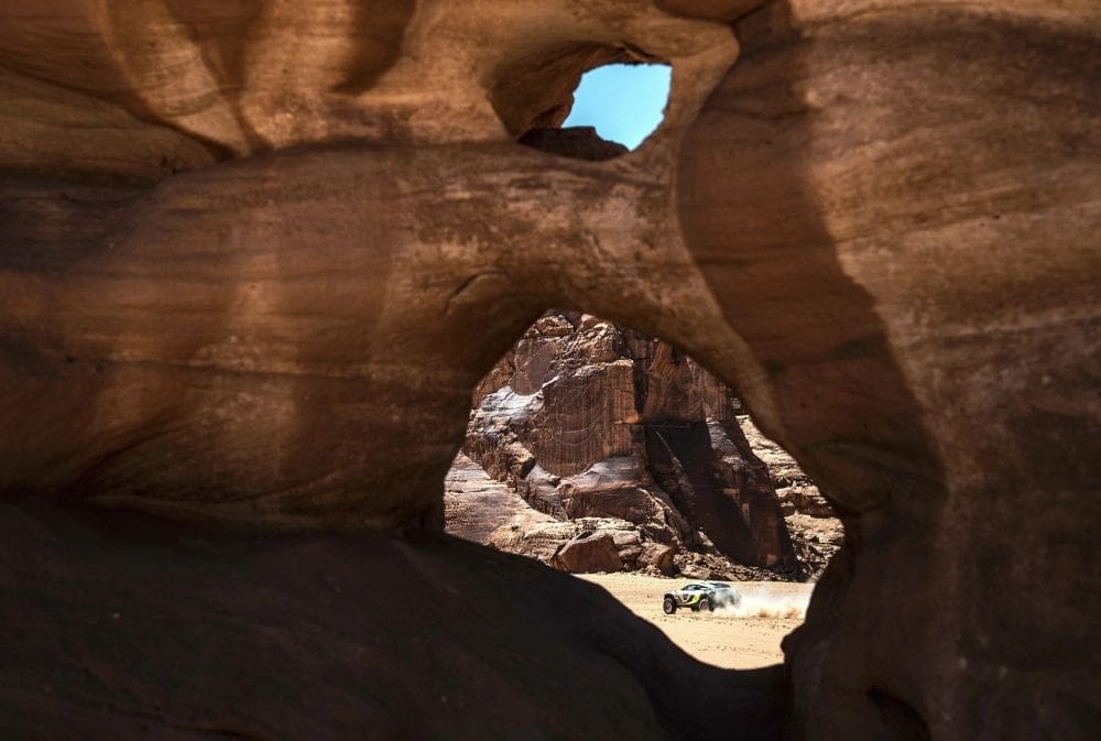 The JBXE team with headliner Jenson Button, the Formula 1 champion, and Mikaela Ahlin-Kottulinksy navigates the Al-'Ula course in preparation for the Desert X Prix. (Photo by Charly Lopez, courtesy of Extreme E) 