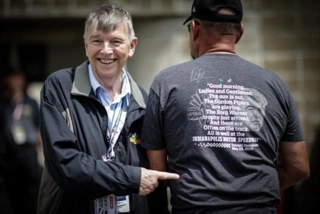 Donald Davidson encounters a fan with a special T-short bearing his words and image. (Photo by Shawn Gritzmacher, courtesy of the Indianapolis Motor Speedway)