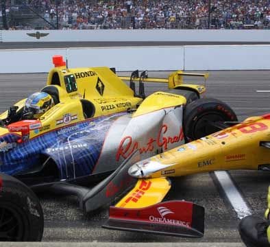 Teammates Ryan Hunter-Reay (foreground) and Townsend Bell collide in a pit-road accident. (Photo by Ann Miller Carr)