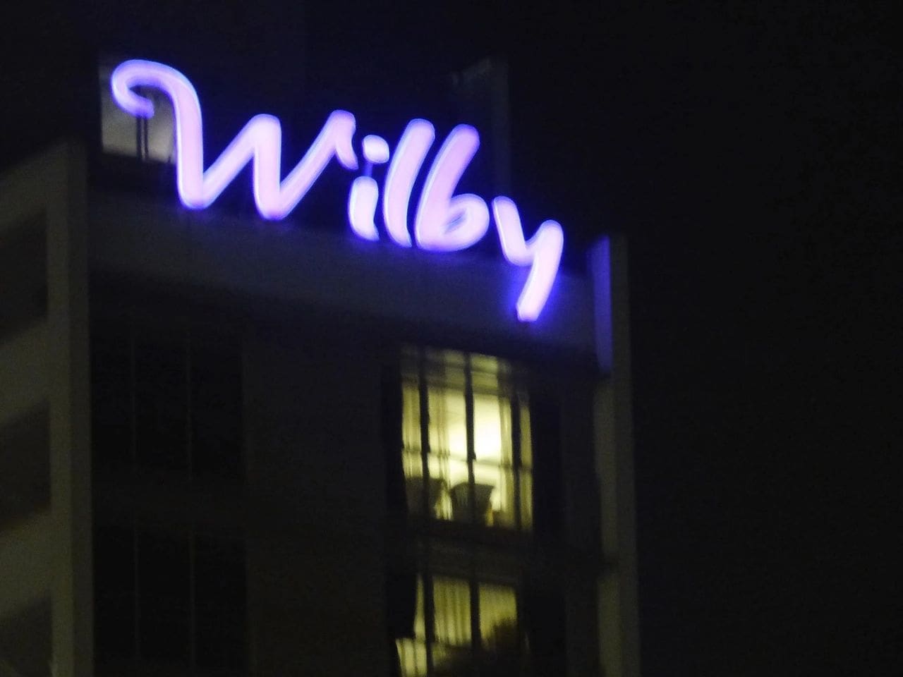 This regrettably out-of-focus "Wilby" sign proves that Bob Wilber has been destined to have his name in neon. Actually, this is a hotel in Singapore, but we'll just pretend it was named for the celebrated drag-racing public-relations representative. (Photo by Susan Wade)